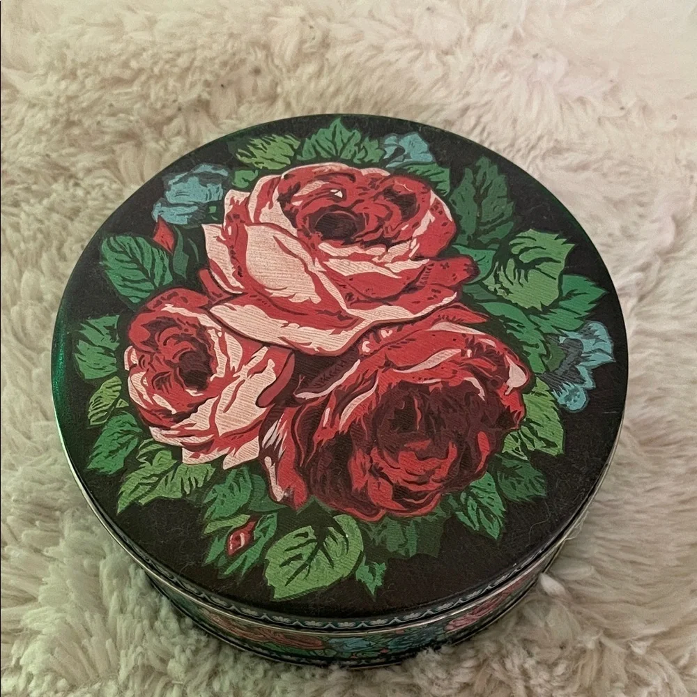 Vintage Floral Round Tin Box with something inside possibly fur knitting